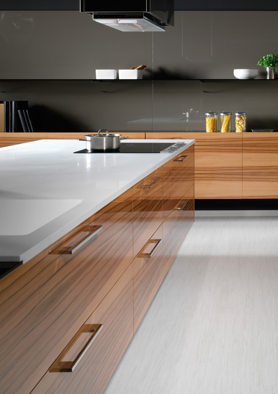 The sliding door with the SLIDER system also represents a hi-tech solution. Modern LINE / PALOMA kitchen in tineo veneer / mocca lacquer - high gloss.
